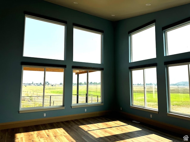 2584 S Country Club Dr Unit 12, Garden City, UT 84028 - empty room with wood finished floors, recessed lighting, and a high ceiling