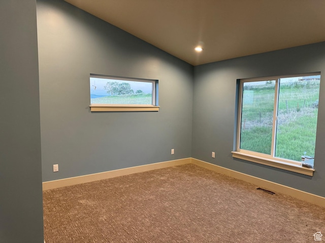 2584 S Country Club Dr Unit 12, Garden City, UT 84028 - carpeted spare room featuring healthy amount of natural light, recessed lighting, and vaulted ceiling