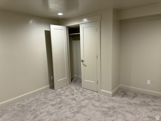 2584 S Country Club Dr Unit 12, Garden City, UT 84028 - unfurnished bedroom with carpet flooring, recessed lighting, and a closet