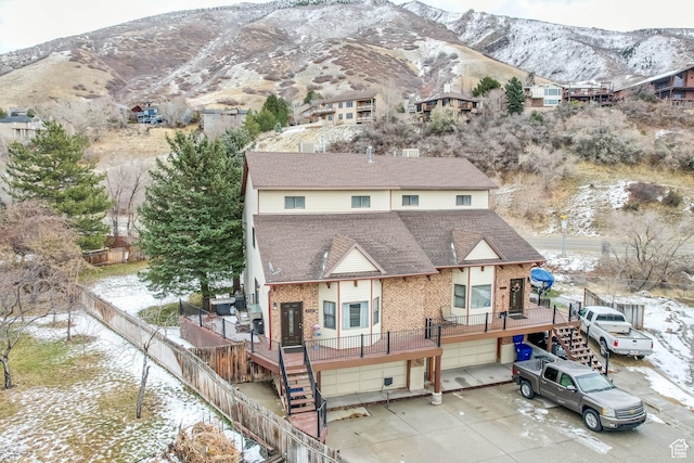 3565 E Summer Estates Cir, Cottonwood Heights, UT 84121 - rear view of house with a mountain view and a garage