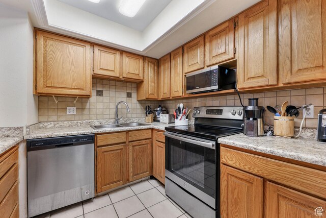 3565 E Summer Estates Cir, Cottonwood Heights, UT 84121 - kitchen featuring decorative backsplash, appliances with stainless steel finishes, a tray ceiling, sink, and light tile patterned flooring
