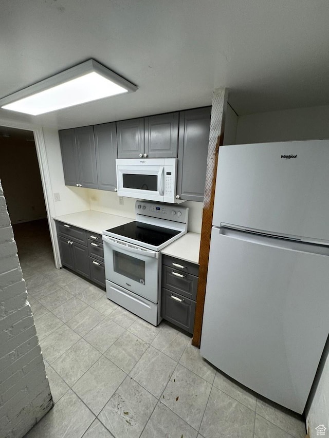 211 N 200 W, Salt Lake City, UT 84103 - kitchen with gray cabinetry and white appliances