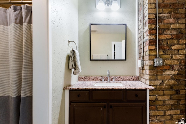 211 N 200 W, Salt Lake City, UT 84103 - bathroom with a shower with curtain, vanity, and brick wall