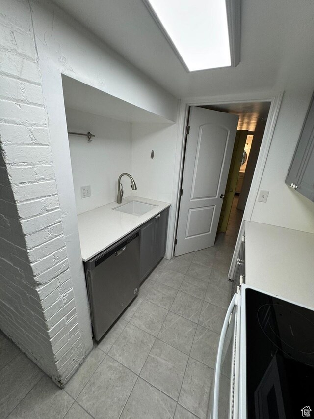 211 N 200 W, Salt Lake City, UT 84103 - kitchen with dishwasher, sink, light tile patterned floors, and range