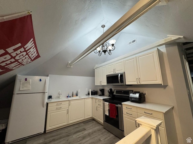 211 N 200 W, Salt Lake City, UT 84103 - kitchen with hardwood / wood-style flooring, vaulted ceiling with beams, sink, and appliances with stainless steel finishes