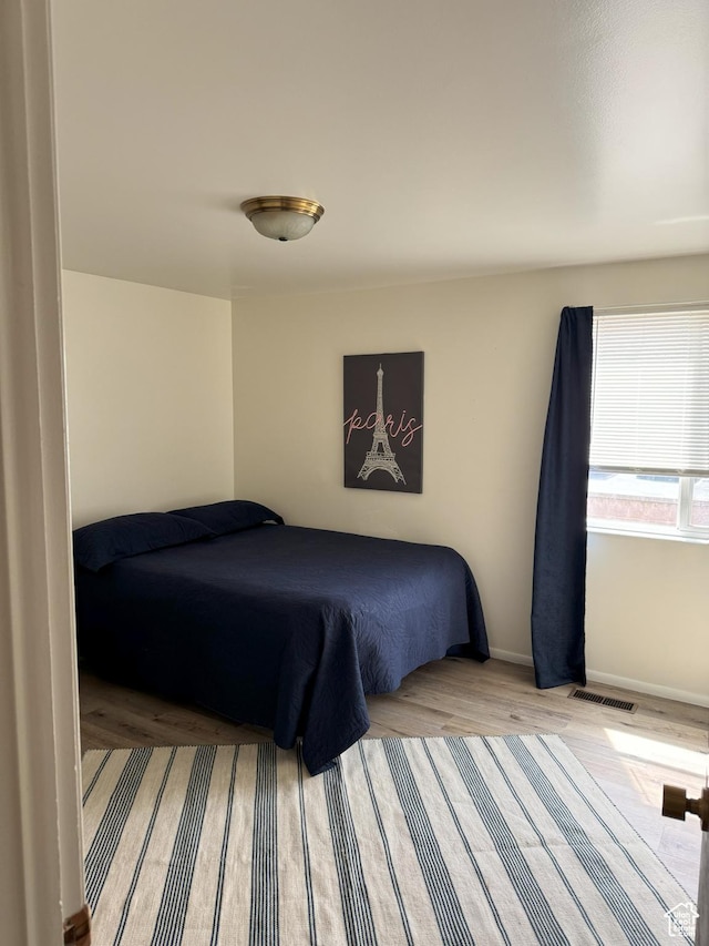 1316 S 200 W Unit 14, Bountiful, UT 84010 - bedroom featuring visible vents, baseboards, and wood finished floors