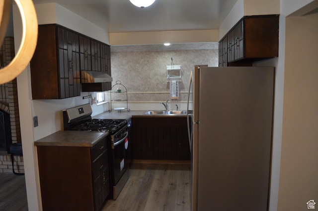 1316 S 200 W Unit 14, Bountiful, UT 84010 - kitchen featuring dark brown cabinetry, light wood-type flooring, under cabinet range hood, stainless steel appliances, and a sink