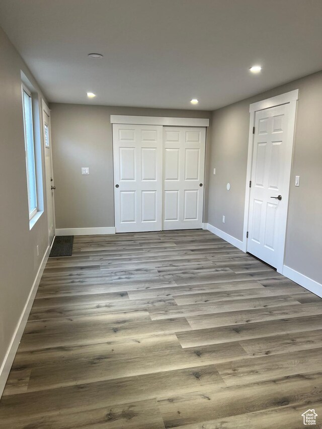 unfurnished bedroom with wood-type flooring
