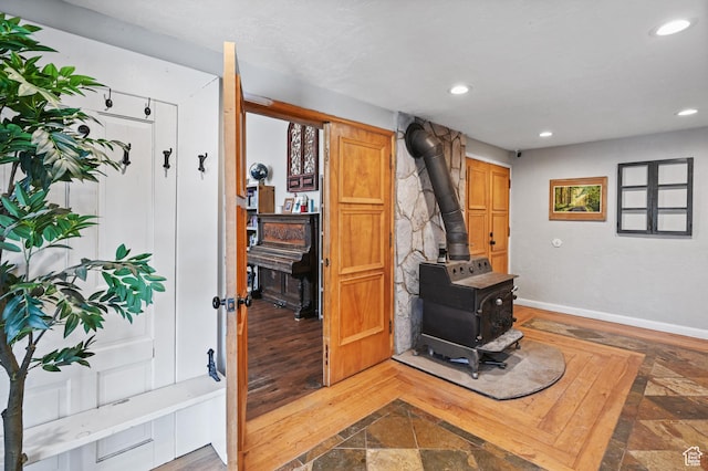 1518 E 9000 N, Preston, ID 83263 - interior space with baseboards, a wood stove, wood finished floors, and recessed lighting