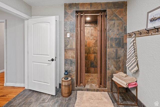 1518 E 9000 N, Preston, ID 83263 - bathroom featuring a shower stall and wood finished floors