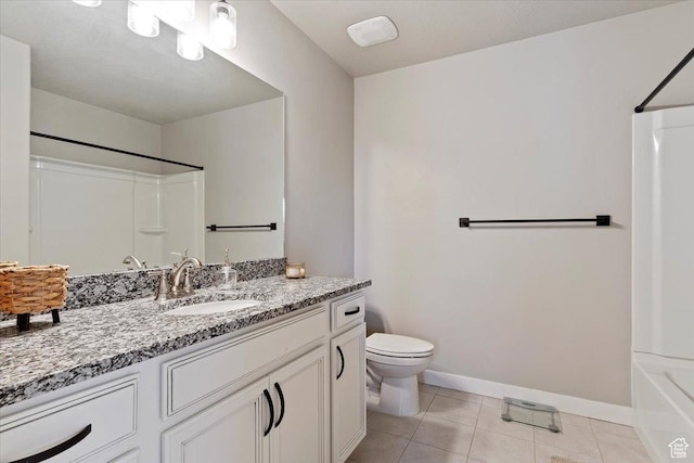 full bath with tile patterned flooring, toilet, shower / washtub combination, vanity, and baseboards