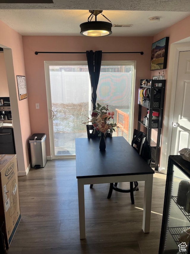 3134 S Buena Verde Ln, Magna, UT 84044 - dining area with a healthy amount of sunlight and wood-type flooring
