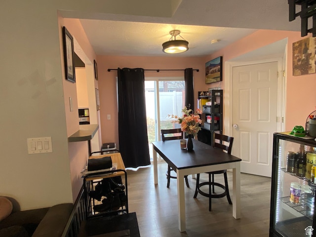 3134 S Buena Verde Ln, Magna, UT 84044 - dining area featuring hardwood / wood-style flooring and wine cooler