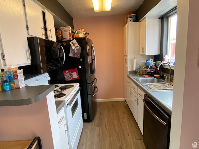 3134 S Buena Verde Ln, Magna, UT 84044 - kitchen with white range with electric cooktop, dishwasher, sink, and white cabinetry