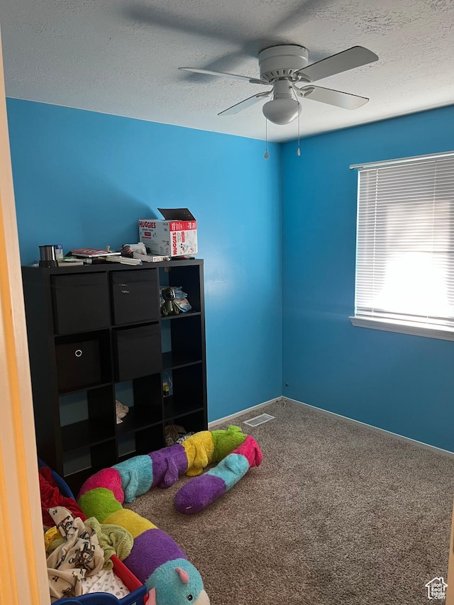 3134 S Buena Verde Ln, Magna, UT 84044 - bedroom featuring ceiling fan, a textured ceiling, and carpet flooring