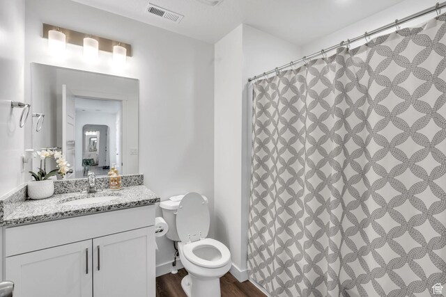 1025 S 850 W, American Fork, UT 84003 - bathroom featuring walk in shower, toilet, vanity, and hardwood / wood-style flooring