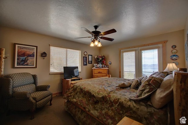 2310 S Sweetwater Pkwy Unit 5, Garden City, UT 84028 - bedroom featuring carpet flooring, a ceiling fan, and baseboards