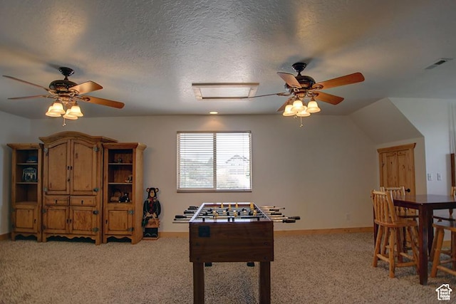 2310 S Sweetwater Pkwy Unit 5, Garden City, UT 84028 - playroom featuring a ceiling fan, light carpet, attic access, baseboards, and a textured ceiling