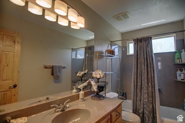 2310 S Sweetwater Pkwy Unit 5, Garden City, UT 84028 - bathroom featuring toilet, shower / bathtub combination with curtain, and vanity