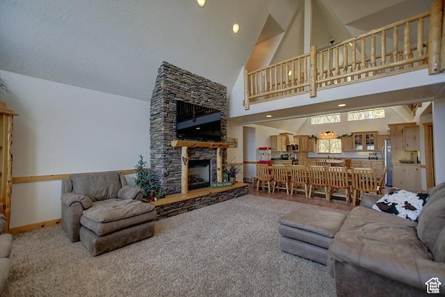 2310 S Sweetwater Pkwy Unit 5, Garden City, UT 84028 - carpeted living area with high vaulted ceiling, a stone fireplace, and baseboards