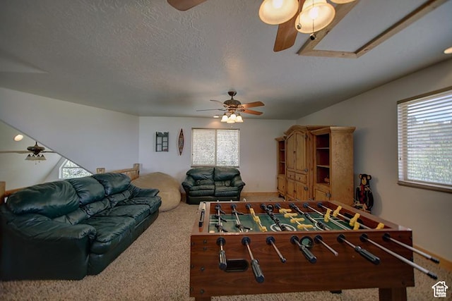 2310 S Sweetwater Pkwy Unit 5, Garden City, UT 84028 - recreation room featuring ceiling fan, healthy amount of natural light, carpet floors, a textured ceiling, and attic access