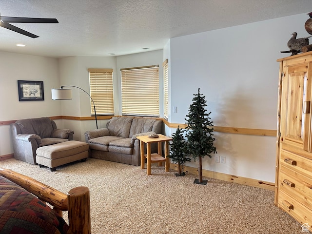 2310 S Sweetwater Pkwy Unit 5, Garden City, UT 84028 - carpeted living room featuring ceiling fan, baseboards, and a textured ceiling