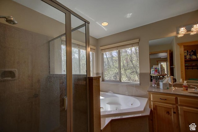 2310 S Sweetwater Pkwy Unit 5, Garden City, UT 84028 - full bath featuring a stall shower, a whirlpool tub, and vanity