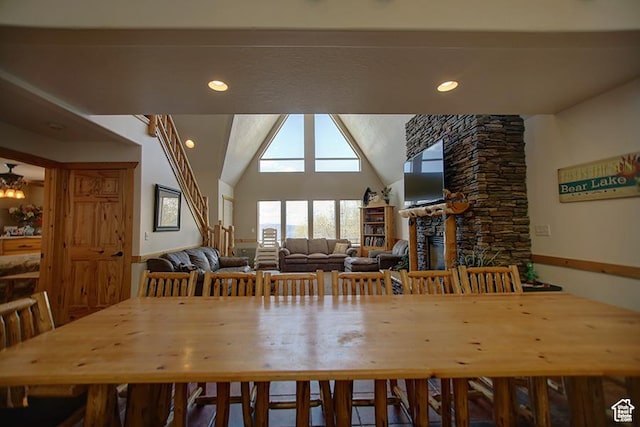 2310 S Sweetwater Pkwy Unit 5, Garden City, UT 84028 - dining room with a fireplace, recessed lighting, and lofted ceiling