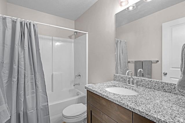 full bathroom featuring vanity, shower / bath combination with curtain, a textured ceiling, and toilet