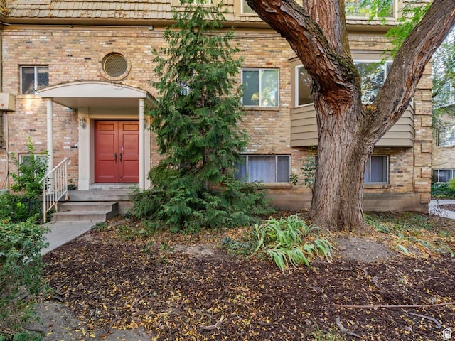 2220 E Murray Holladay Rd Unit 122, Salt Lake City, UT 84117 - property entrance featuring brick siding