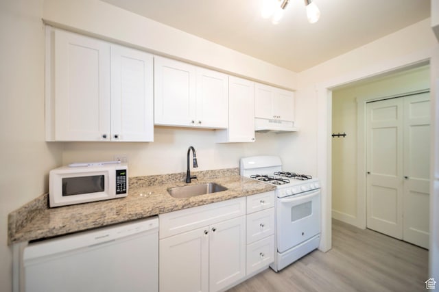 2220 E Murray Holladay Rd Unit 122, Salt Lake City, UT 84117 - kitchen with white appliances, a sink, under cabinet range hood, and white cabinets
