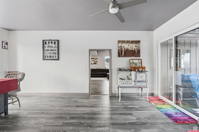 2923 S Country Club Way Unit 46, Garden City, UT 84028 - dining space featuring ceiling fan, wood finished floors, and baseboards