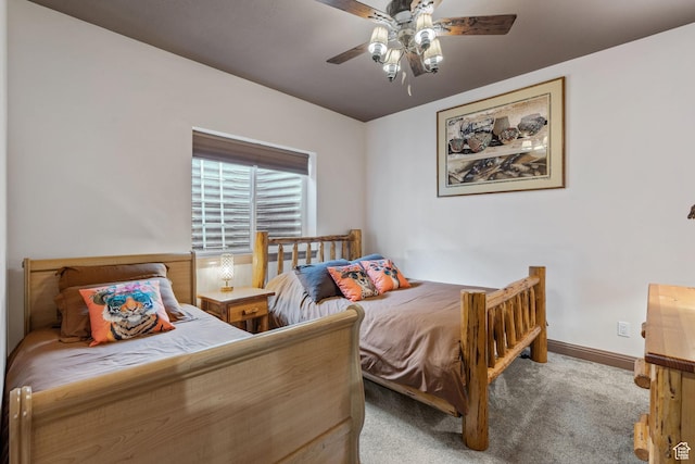 2923 S Country Club Way Unit 46, Garden City, UT 84028 - carpeted bedroom featuring baseboards and a ceiling fan