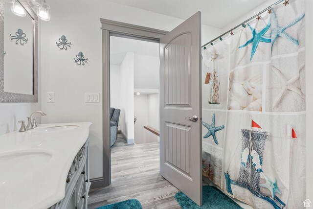 2923 S Country Club Way Unit 46, Garden City, UT 84028 - bathroom featuring wood finished floors and double vanity