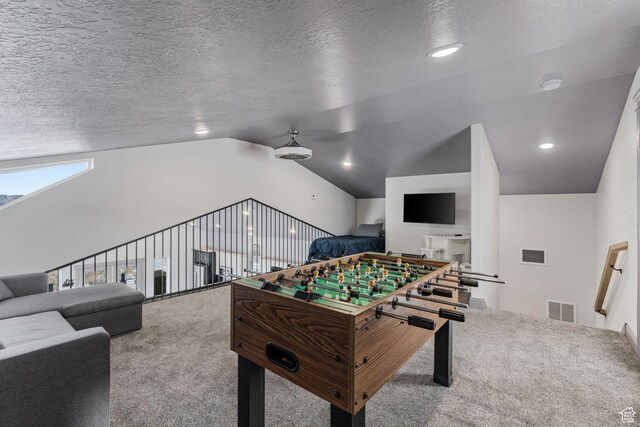 2923 S Country Club Way Unit 46, Garden City, UT 84028 - playroom with carpet, lofted ceiling, and a textured ceiling