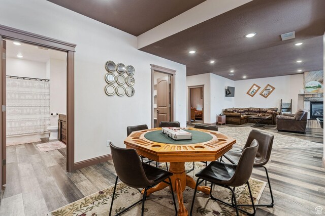 2923 S Country Club Way Unit 46, Garden City, UT 84028 - dining area with wood finished floors, baseboards, and recessed lighting