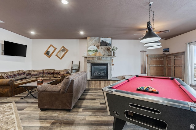 2923 S Country Club Way Unit 46, Garden City, UT 84028 - playroom featuring wood finished floors, a glass covered fireplace, pool table, recessed lighting, and a textured ceiling