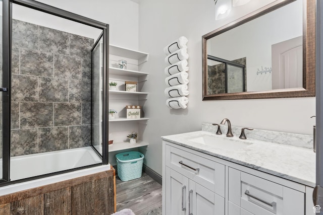 2923 S Country Club Way Unit 46, Garden City, UT 84028 - full bath featuring wood finished floors, vanity, and enclosed tub / shower combo