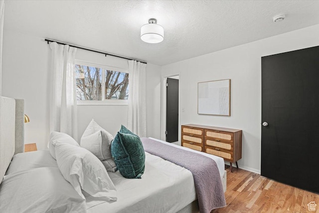 2660 W 10950 S, South Jordan, UT 84095 - bedroom featuring a textured ceiling and hardwood / wood-style flooring