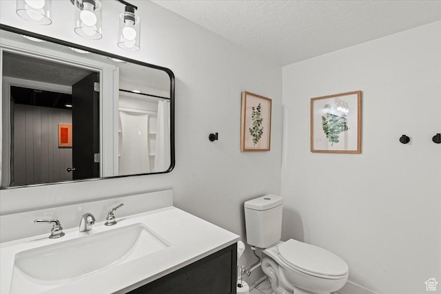 2660 W 10950 S, South Jordan, UT 84095 - bathroom featuring vanity, toilet, and a textured ceiling