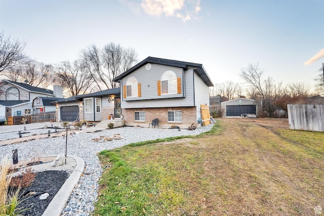 556 W 1050 N, Pleasant Grove, UT 84062 - back of property with an attached garage, brick siding, fence, and a lawn