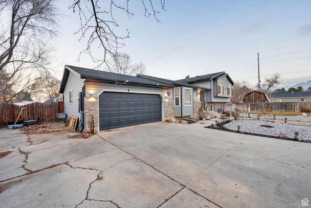 556 W 1050 N, Pleasant Grove, UT 84062 - tri-level home featuring driveway, a garage, and fence