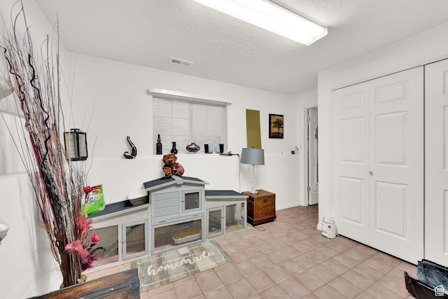 556 W 1050 N, Pleasant Grove, UT 84062 - mudroom with a textured ceiling, visible vents, and tile patterned floors