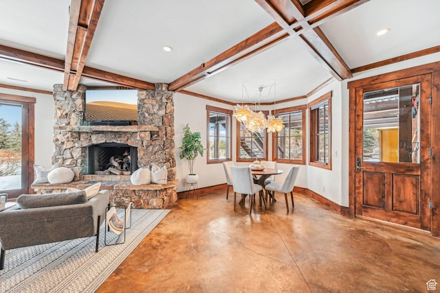 living room with concrete flooring, a healthy amount of sunlight, a fireplace, and coffered ceiling