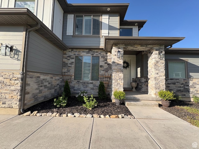 3234 S Iron Hill Cir S, Saratoga Springs, UT 84045 - doorway to property with a porch and stone siding