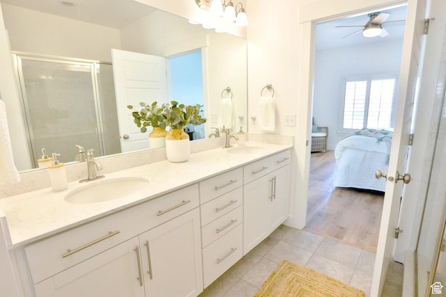 3234 S Iron Hill Cir S, Saratoga Springs, UT 84045 - bathroom with ceiling fan, a shower stall, double vanity, tile patterned flooring, and ensuite bathroom