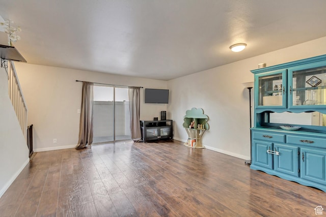 5235 S Glendon St W Unit W3, Salt Lake City, UT 84123 - living room featuring dark wood finished floors, baseboards, and stairway