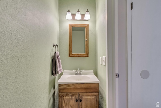 5235 S Glendon St W Unit W3, Salt Lake City, UT 84123 - bathroom featuring vanity and a textured wall