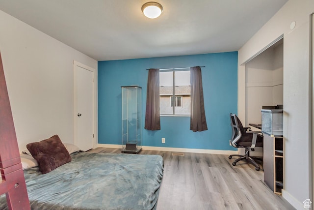 5235 S Glendon St W Unit W3, Salt Lake City, UT 84123 - bedroom featuring wood finished floors, baseboards, and a desk