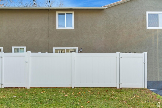 5235 S Glendon St W Unit W3, Salt Lake City, UT 84123 - view of side of property with a gate and stucco siding